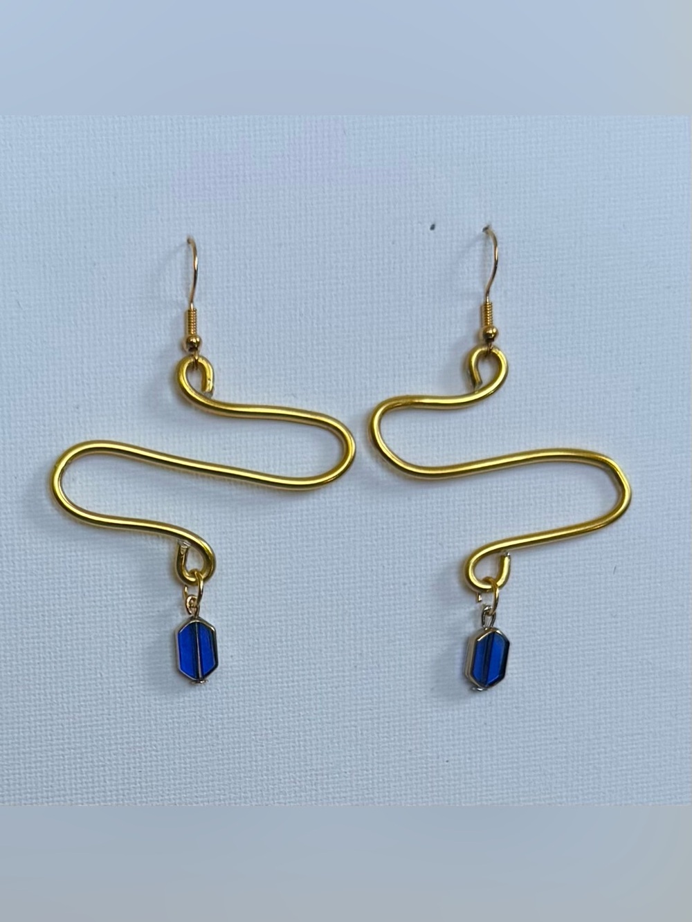 Handmade Gold Wire Wavy Drop Earrings with Dangling Blue Hex Pendant Beads